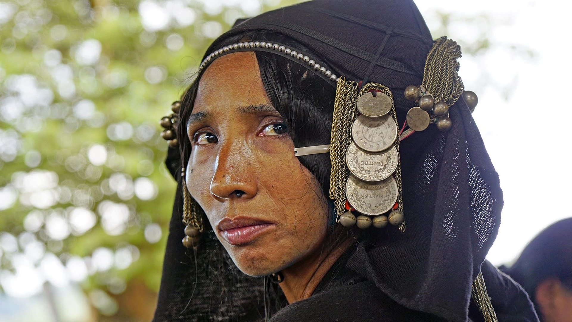 Oma Woman in Laos wearing a fashion style that was appropriated by fashion design house Max Mara.
