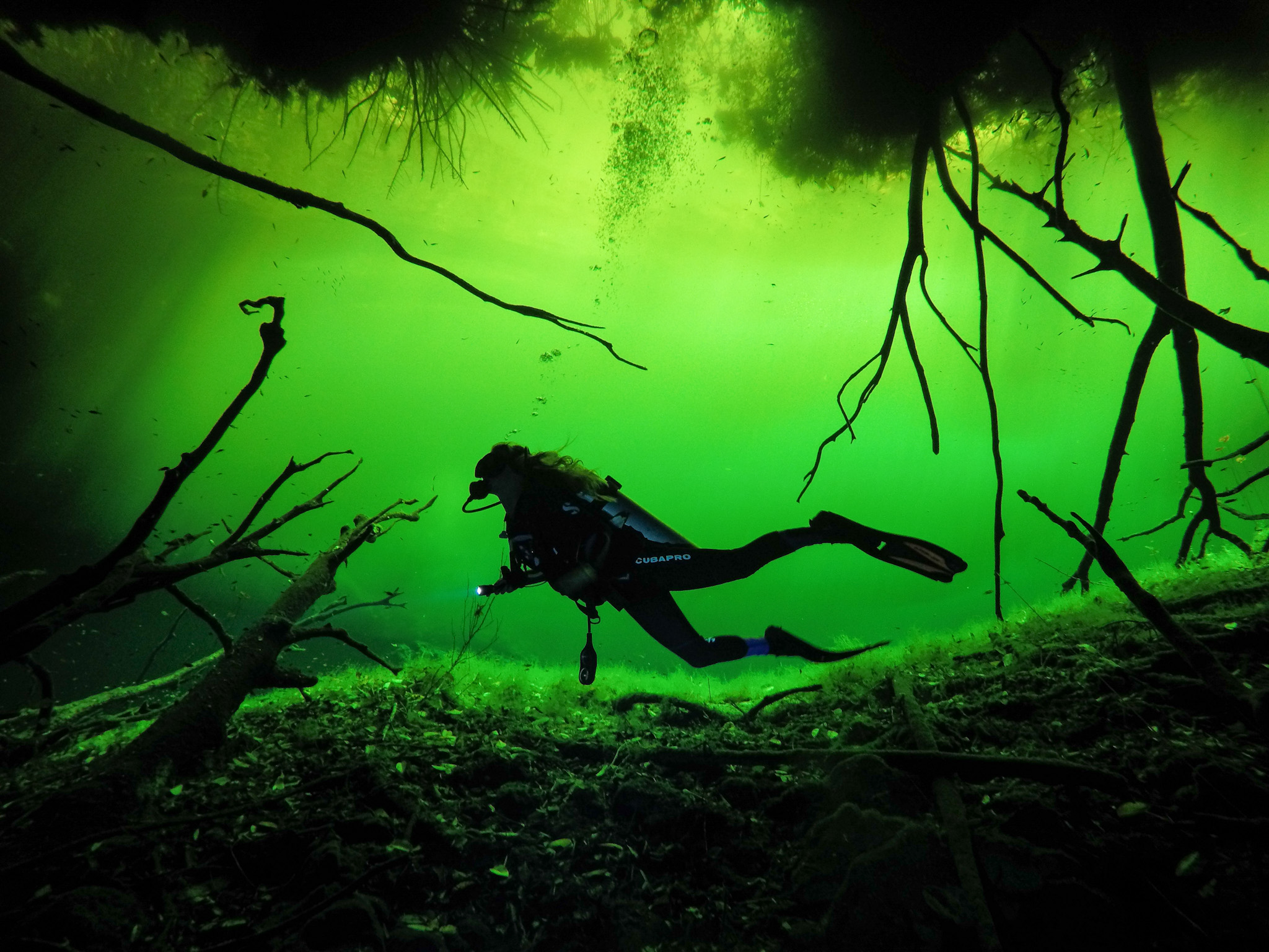 Author Kellie Paxian. Cenote diving in Tulum. Photo: @Tulum.breathtaking