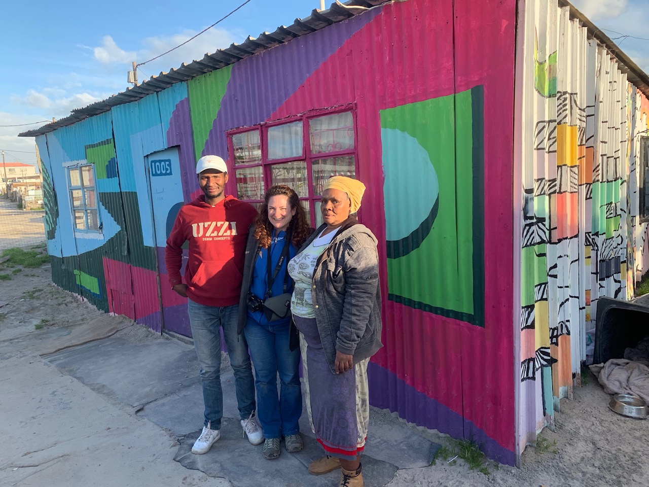 Heather with her guide and one of the tenants in the Khayelitsha township in Cape Town. Photo courtesy of Heather Markel