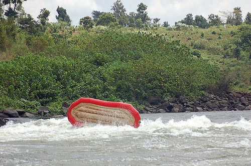 Raft flipping in water