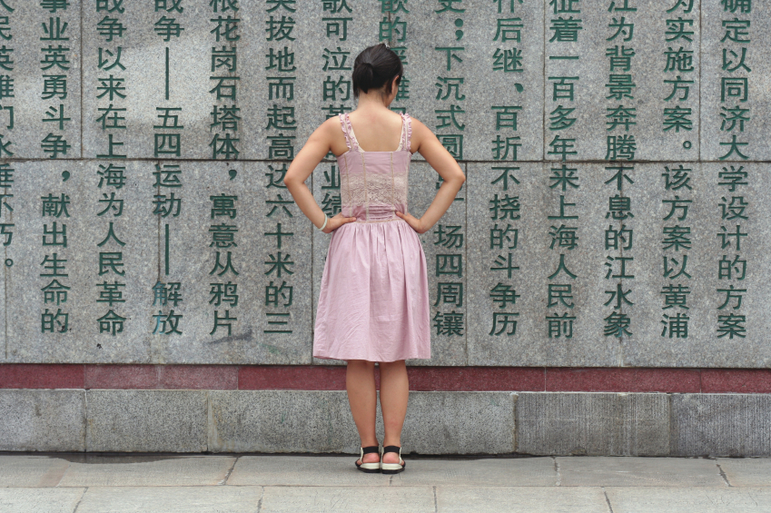 Girl at wall in China