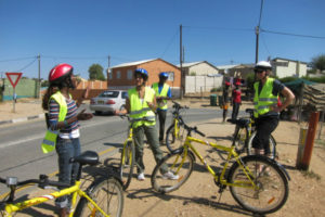 Tour guide Anna prepares group for bike tour through Katutura, Namibia. Photo: Chris Chesak