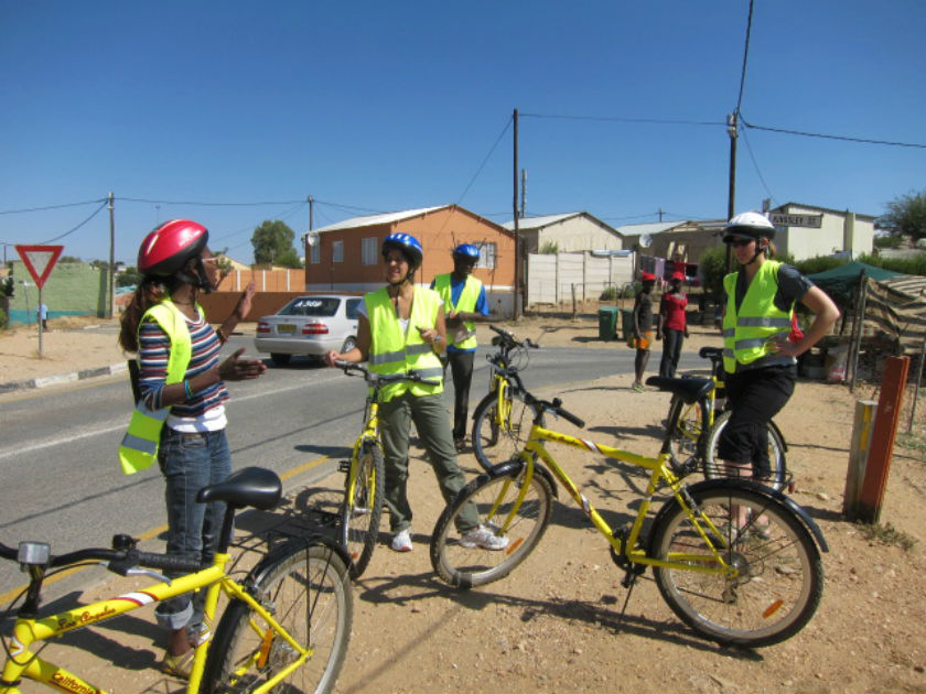 Tour guide Anna prepares group for bike tour through Katutura, Namibia. Photo: Chris Chesak