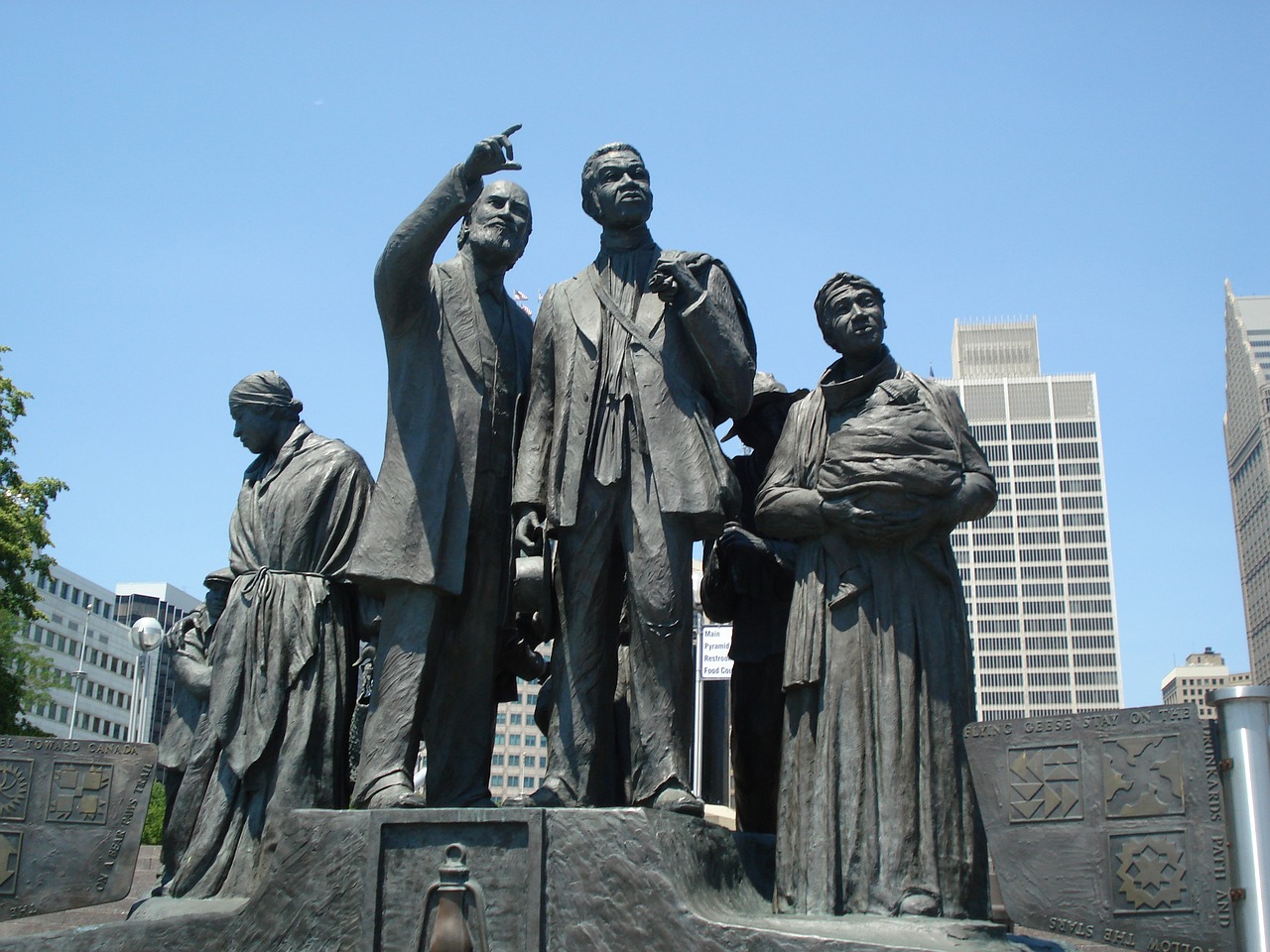 This mural honors the underground railroad. The figures are facing Ontario, Canada from the Detroit Riverwalk.