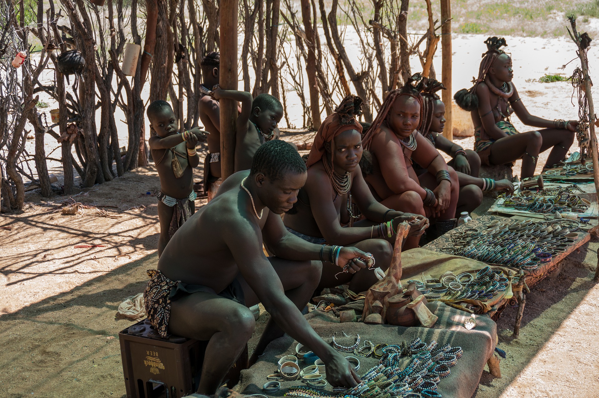 Himba tribe members displaying their wares.