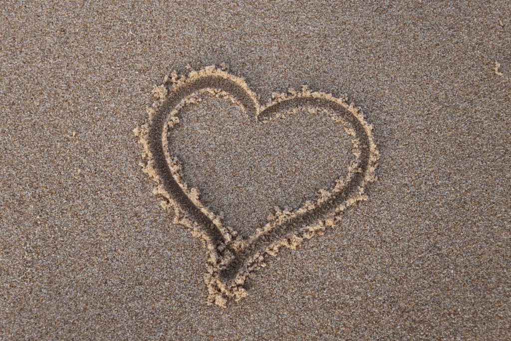 A heart in the sand for loving traveling couples