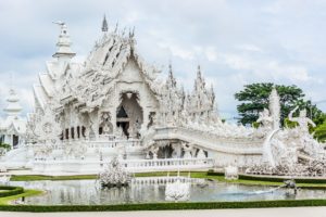 The White Temple (Wat Rong Kun), is a privately-owned art exhibit inside a Buddhist temple styled contemporary building. The unconventional building was opened to the public in 1997 by designer and owner Chalermchai Kositpipat.