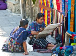 Mayan women enjoying their craft of weaving.