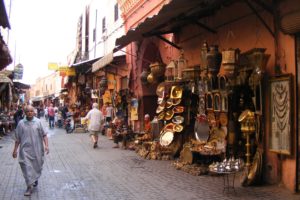 The narrow alley in the Souk des Ferronniers, in the Marrakech medina is lined with lamps and other crafts.
