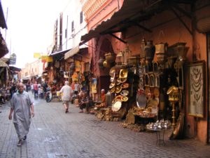 The narrow alley in the Souk des Ferronniers, in the Marrakech medina is lined with lamps and other crafts.