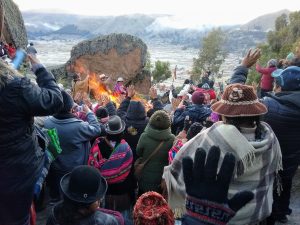 Photo credit: Renee Alexander / Sun worshipers welcome the Winter Solstice sunrise with raised hands and open hearts.