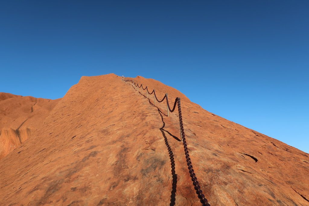 Rock climb chain on Uluru.