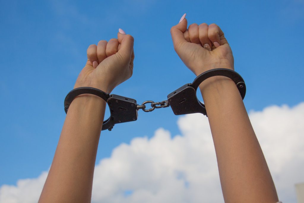 Handcuffed with sky background reflects a night in a Mexico jail