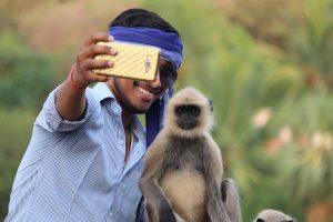 selfie-with-monkey-animal tourism