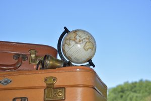 Missing travel with luggage and world globe