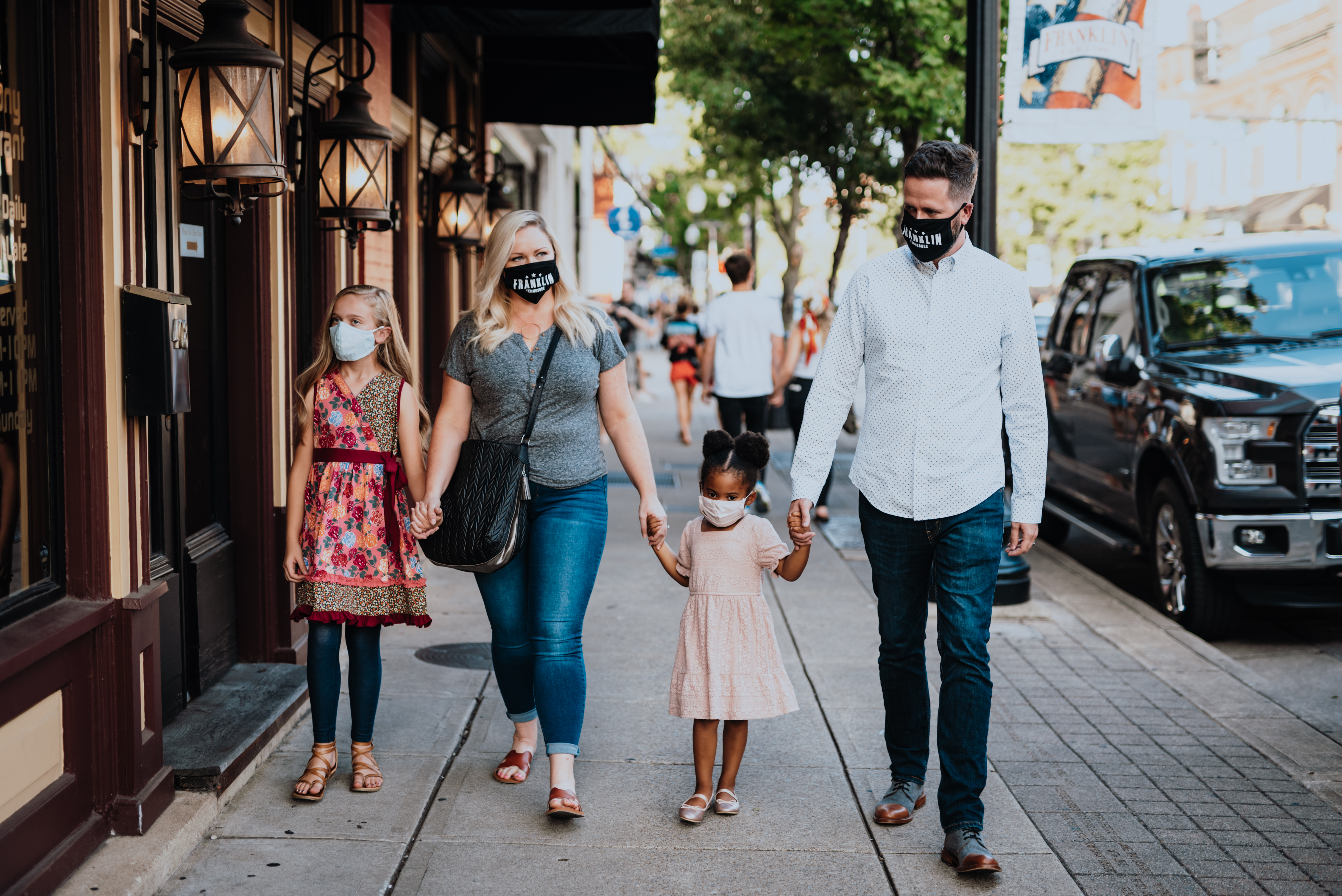 A family strolls down the iconic Main Street 