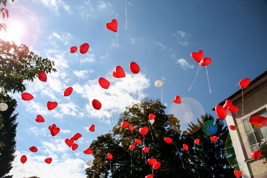 Red-heart-balloons-released-in-the-air. Big No No!