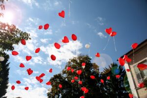 Red-heart-balloons-released-in-the-air. Big No No!