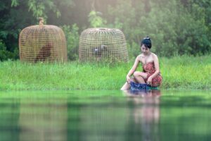 Fashionable-Laos-woman-doing-laundry-at-river