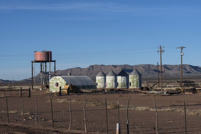 Weathered metal structures in the mostly deserted town of Lobo.