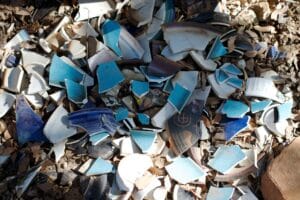 Pile of broken dishes by cogdogblog is licensed under CC BY 2.0