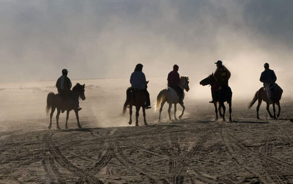 A group of horsemen crossing the Sea of Sand towards Mt. Bromo, another active volcano. Photo: Sugato Mukherjee