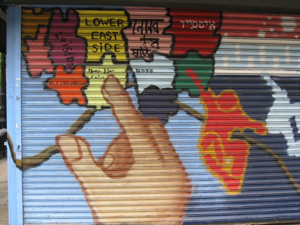 "Mural on a riot gate: ethnic enclaves of the Lower East Side" by Salim Virji is licensed under CC BY-SA 2.0 
