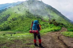 Backpacker facing a mountain in Asia
