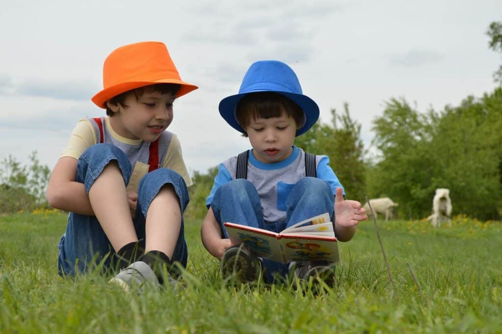 Boys-reading-in-a-field