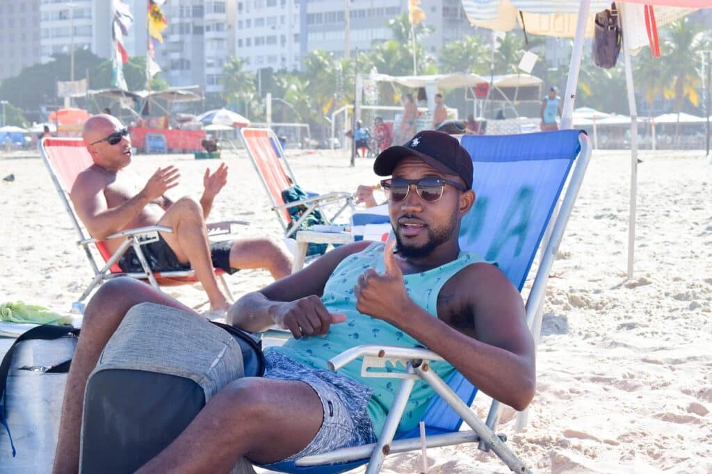 Male travelers in Brazil on Copacabana Beach