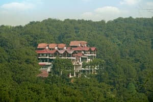 03. Ri Kynjai is built into the forested slopes of a hill adjacent to the lake scaled