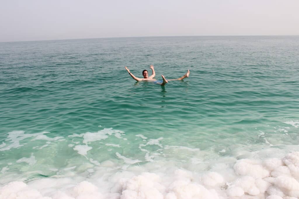 Author floating in the Dead Sea of Israel.
