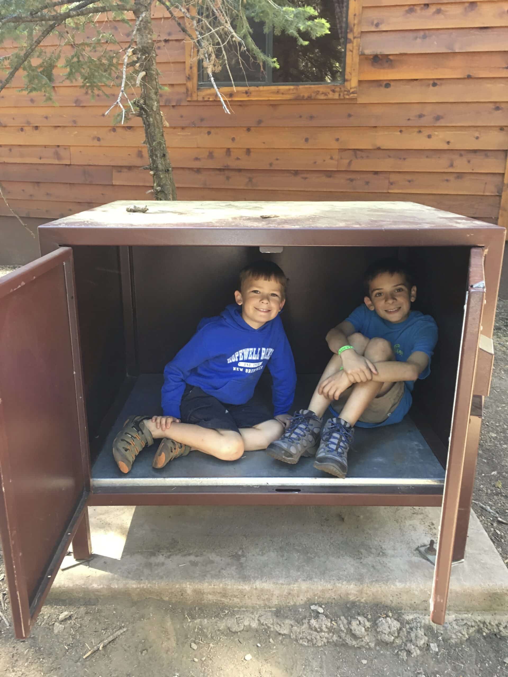 Photo of kids playing in a bear box storage. Photo: Catherine Parker