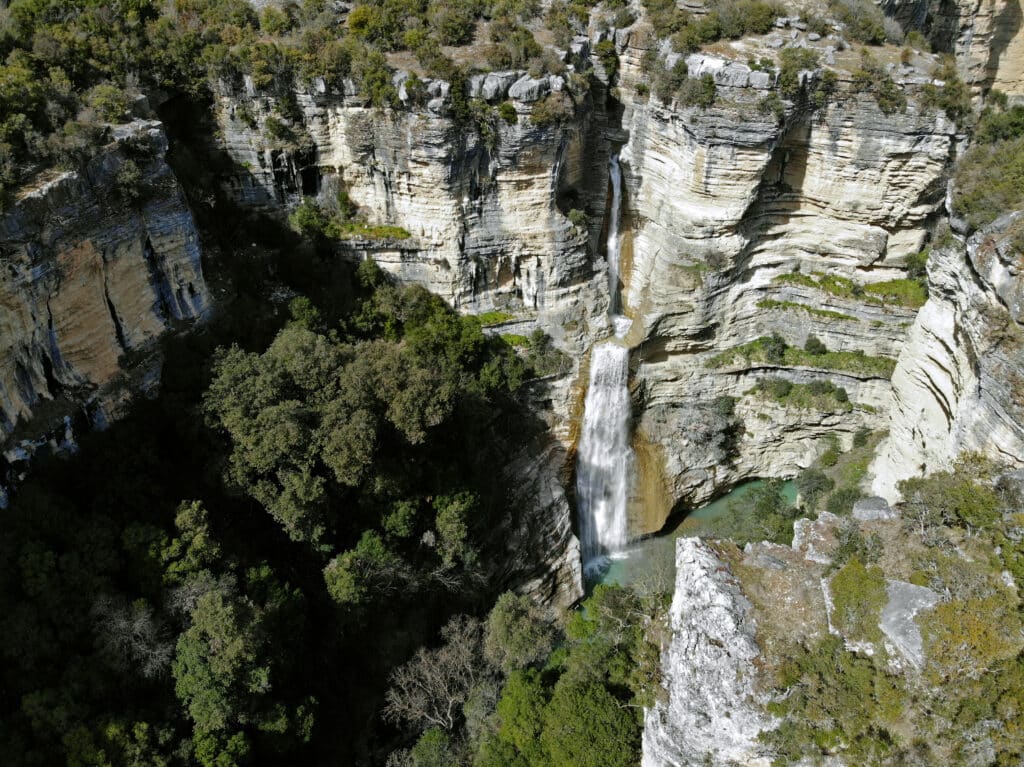 Aerial pictures of a huge waterfall dropping down into Osum Canyon.