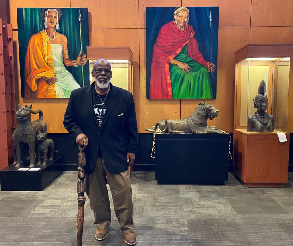 Founder of the Museum - Lamont Collins amid portraits of Royalty. Photo: Terri Marshall