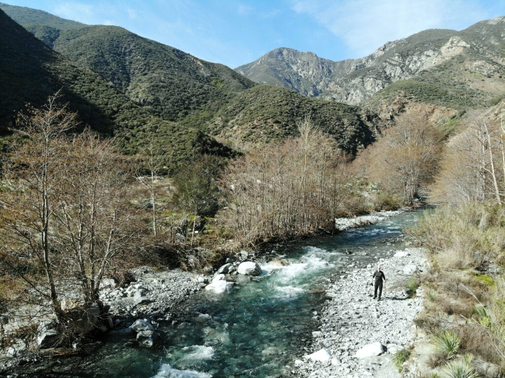 Aerial-picture-of-the-author-walking-alongside-the-turquoise-river. Photo: Thomas Später