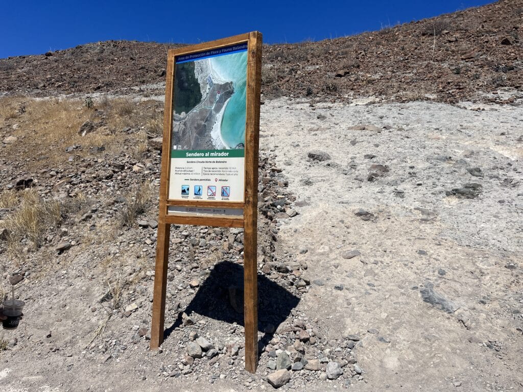 3 Beach sign with short uphill hiking trail, located on the right side after passing the entrance gate.