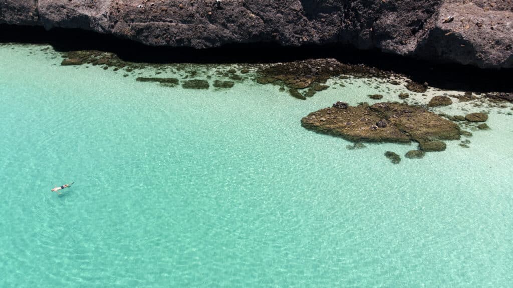 5 Aerial picture of the author floating in the crystal clear water of Balandra Bay