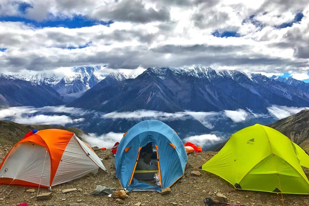 Adventure travelers camping out on Mount Gonnga.