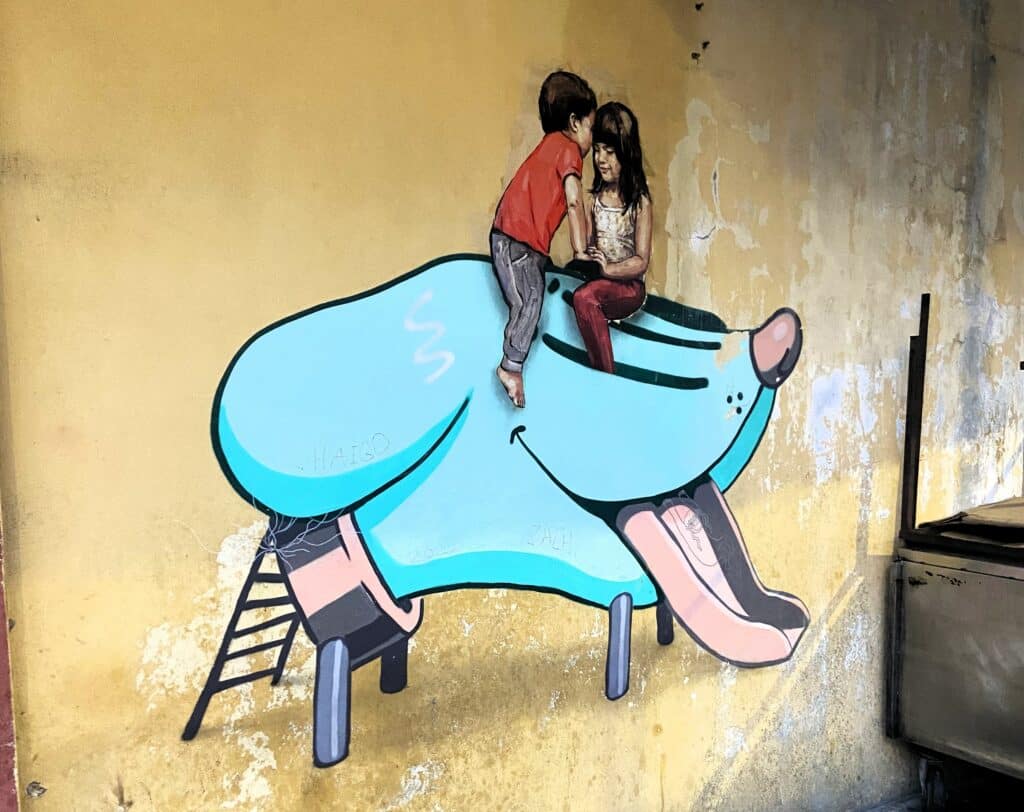 Blue dog with children street art in Penang. Photo: Ann-Marie Cahill